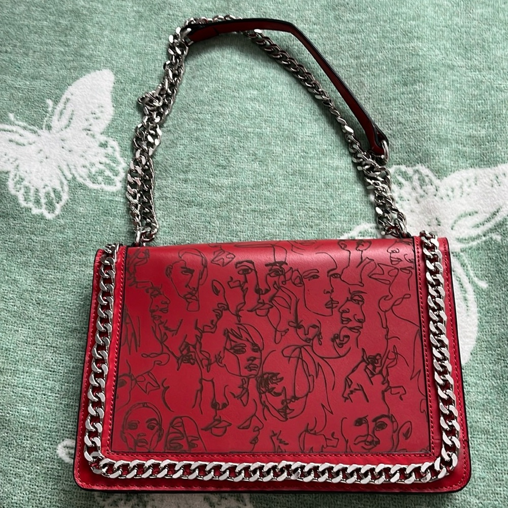 A red over the shoulder purse